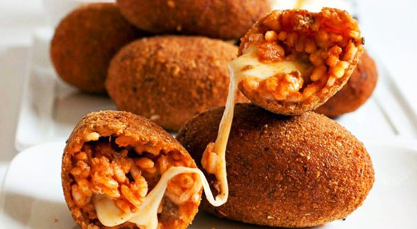 Supplì filled with mozzarella. tomato sauce and rice